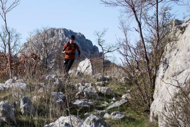 full-shot-man-running-forest_23-2149436733